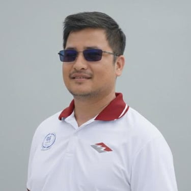 a man in a white shirt and sunglasses
