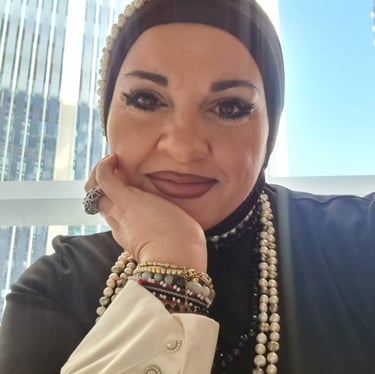 a woman in a black jacket and pearls