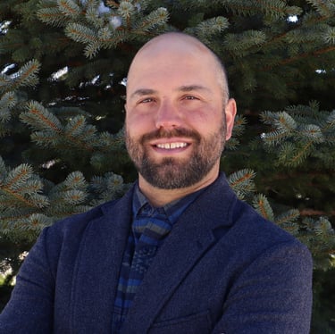 Professional headshot of Elliott Paull owner of Enclave Property Management