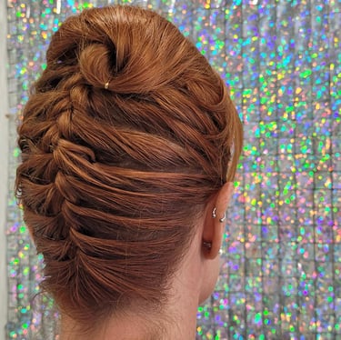 Elegant twisted updo on auburn hair