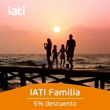 Silhouette of a family on a pier at sunset promoting IATI Familia travel insurance.