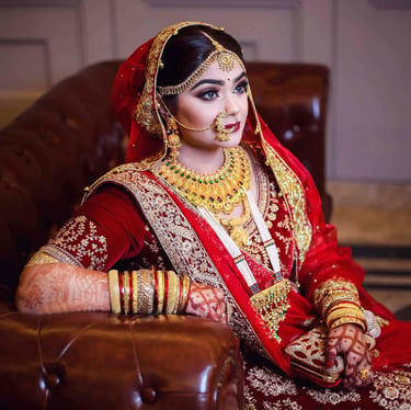 a bride in a red and gold bridalle wedding dress