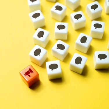 Image of a one bullhorn icon projecting out many messages to numerous chat bubble icons