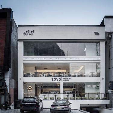 Cars parked in front of Tovo Restaurant