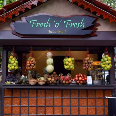 a fruit stand with fruit and vegetables on display