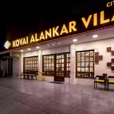 a building with a sign that says kovai alankar villas