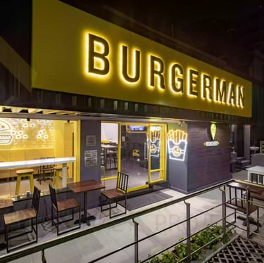 a restaurant with a large sign that says burgerman