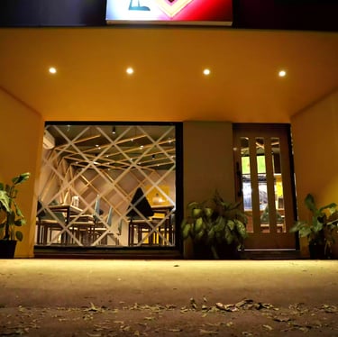 a restaurant entrance with a sign board