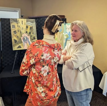 Takara Welter discussing an original Takara Welter painting at an Art Showing