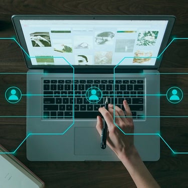 Hand on laptop keyboard with digital network icons representing social media connections and remote collaboration.