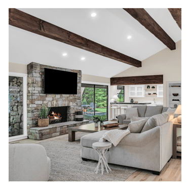 a living room with a couch and a fireplace