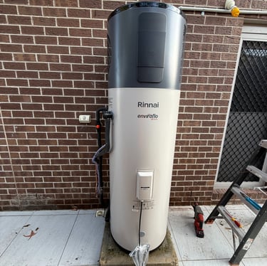 a water heater sitting on a sidewalk