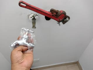 a person holding a wrenet in their hand