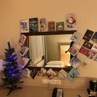 Christmas tree and christmas cards set up in hotel room at AquaPalace