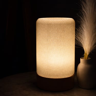 Supra lamp glowing with warm golden light in modern interior