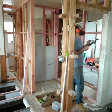 an architect man in a construction site with a hammer hammer