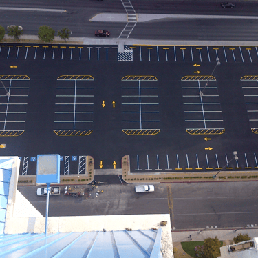 work crew striping a parking lot