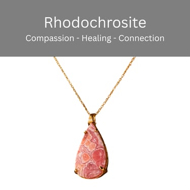 A teardrop-shaped pink rhodochrosite crystal pendant on a delicate gold chain necklace.