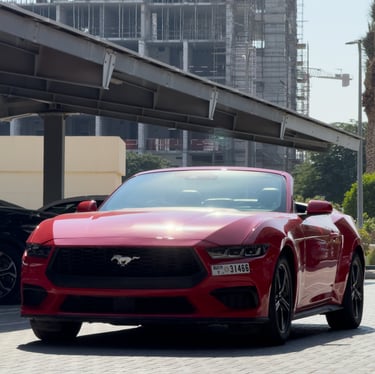 Red sports car luxury car rental Dubai premium performance vehicle