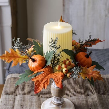 Thanksgiving candle wreath with orange maple leaves, pumpkins, and berries