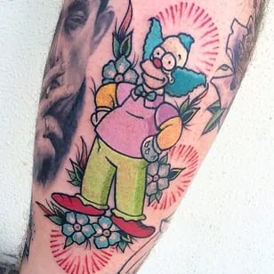 a tattoo of a cartoon character on a man's leg