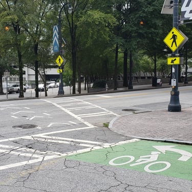 Two-stage bicycle turn queue box and crosswalk with RRFB