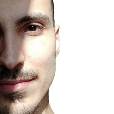 a man with a beard and a tie on his neck