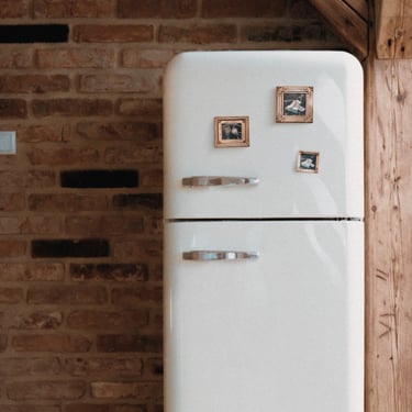 a fridge with tiny painted magnets