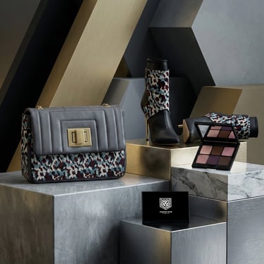 a woman's purse and a pair of boots with eyeshadow palette