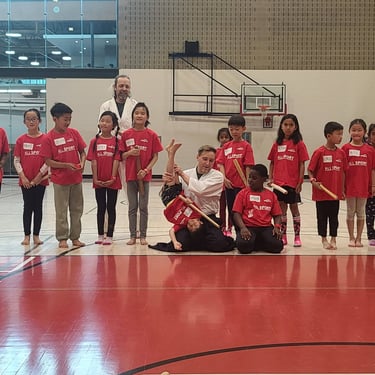 group photo after aikido seminar for kids