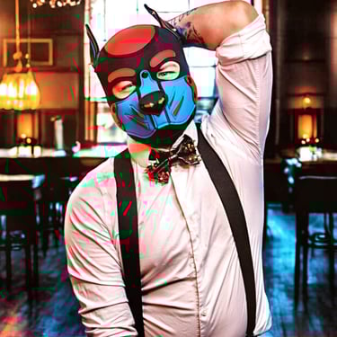 Man in a pup mask and bow tie.