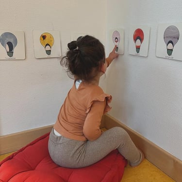 a young girl is playing with a toy