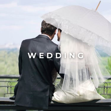 "Wedding", newlyweds with premium wedding umbrella