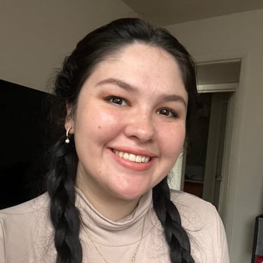 a woman with long hair and a necklace