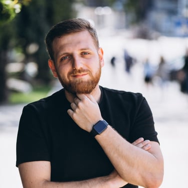 a man with a beard and a watch on his wrist