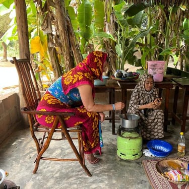 Tourist participating in a step-by-step cooking class coached by a local guide during a luxury Zanzibar spice tour, learning