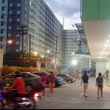 a group of people walking down a street