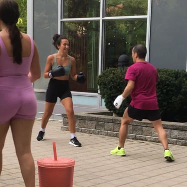 A group of people training Jeet Kune Do martial arts in a North York courtyard area.