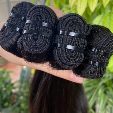 Close-up of machine weft bone straight Vietnamese hair with strong stitching