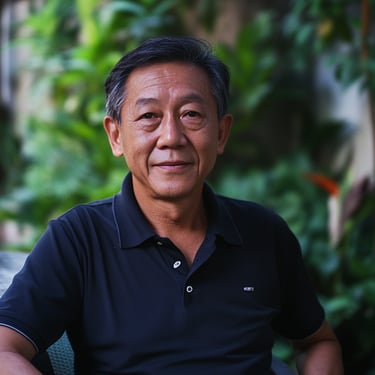 Landscaping client, Asian Male in his 60s, seated in an alfresco dining area at a garden
