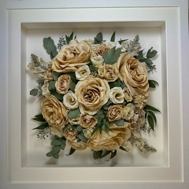 a Birdseye view preserved wedding bouquet in a frame