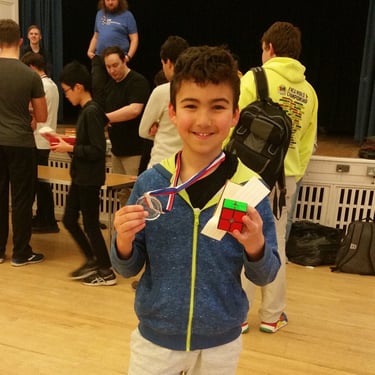 James Alonso holding up his first medal at a competition