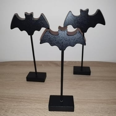 Three black wooden bat figurines on stakes with bases, Gothic Halloween tabletop decoration