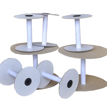 a paper bobbin spool with paper rolls of paper