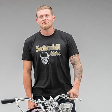 Man standing by motorcycle