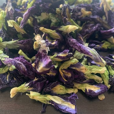 a pile of dried blue butterfly pea flower petals
