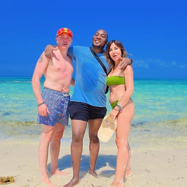 A local Zanzibar tour guide with a couple of tourists enjoying the stunning beaches of Mnemba Island.