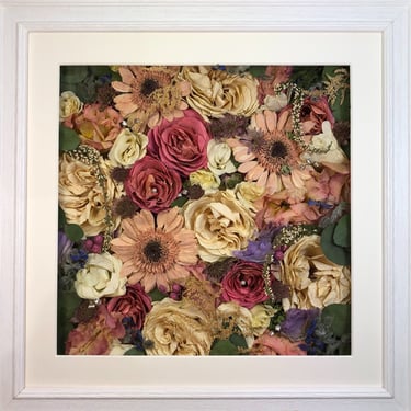 a flower wall style preserved wedding bouquet with soft pink gerberra flowers in a frame