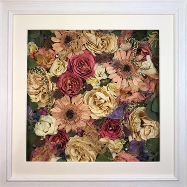 a flower wall style preserved wedding bouquet with soft pink gerberra flowers in a frame
