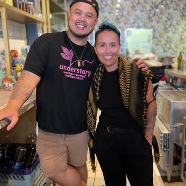 two understory collective participants standing in a kitchen